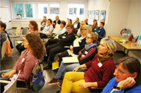 sitzende Teilnehmer bei der Fachveranstaltung zum Thema „Partizipation von Kindern“ im Oktober 2016